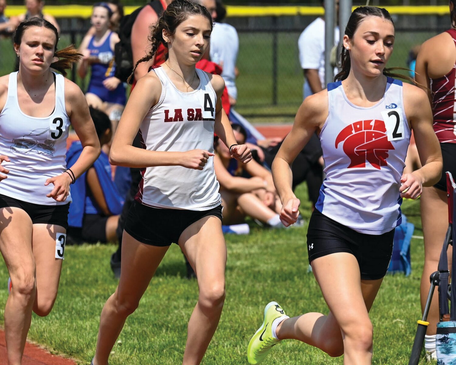 FIRST PLACE: Toll Gate’s Alison Pankowicz (right), who won the 1,500 competes against Pilgrim’s Keaney Bayha (left), who took third.